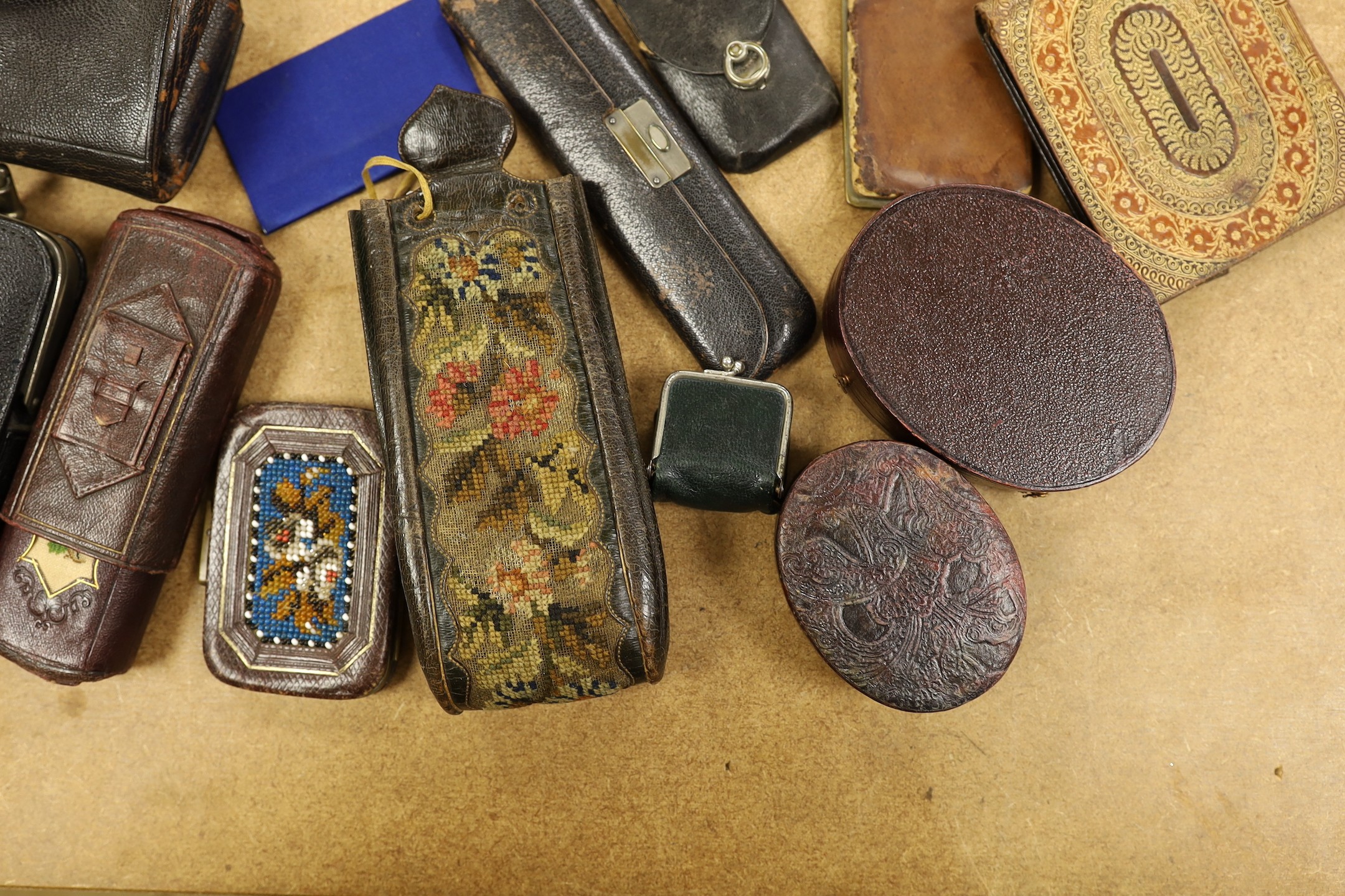 A large collection of unusual Morocco leather purses, bags and containers, some embossed and some with petite point embroidery, mostly 19th century.